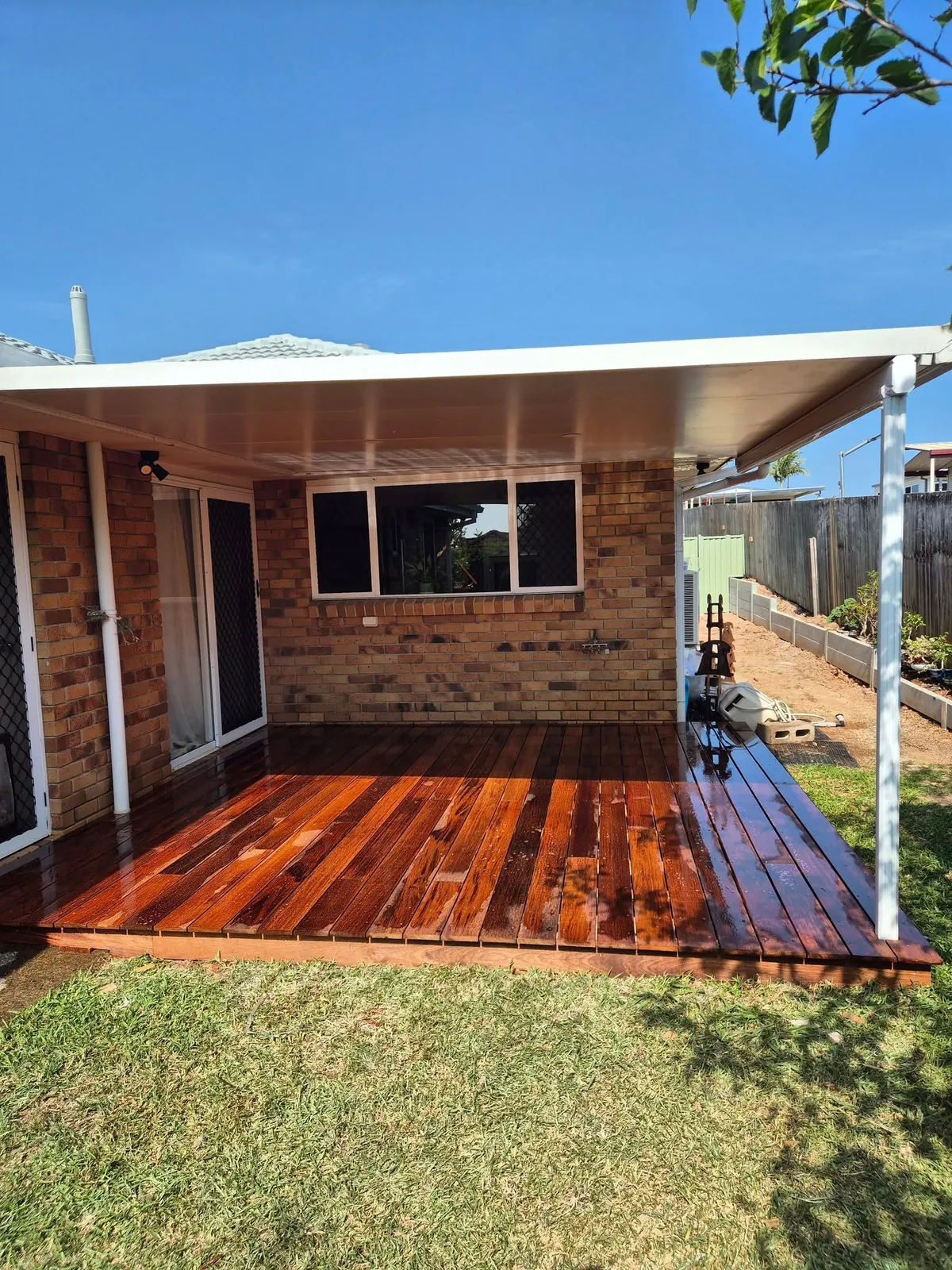 Rear deck off a brick home