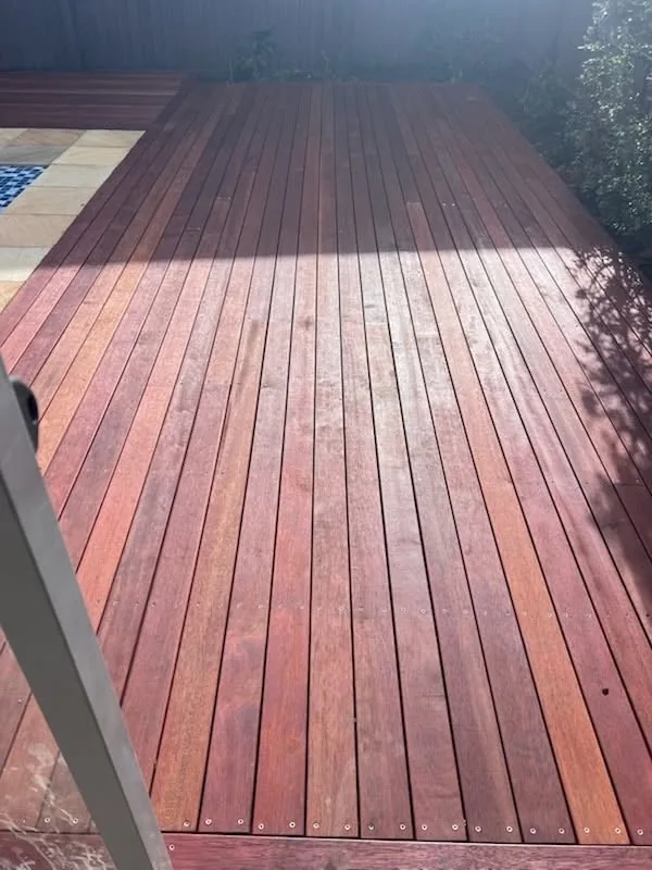 Freshly finished deck under a patio roof