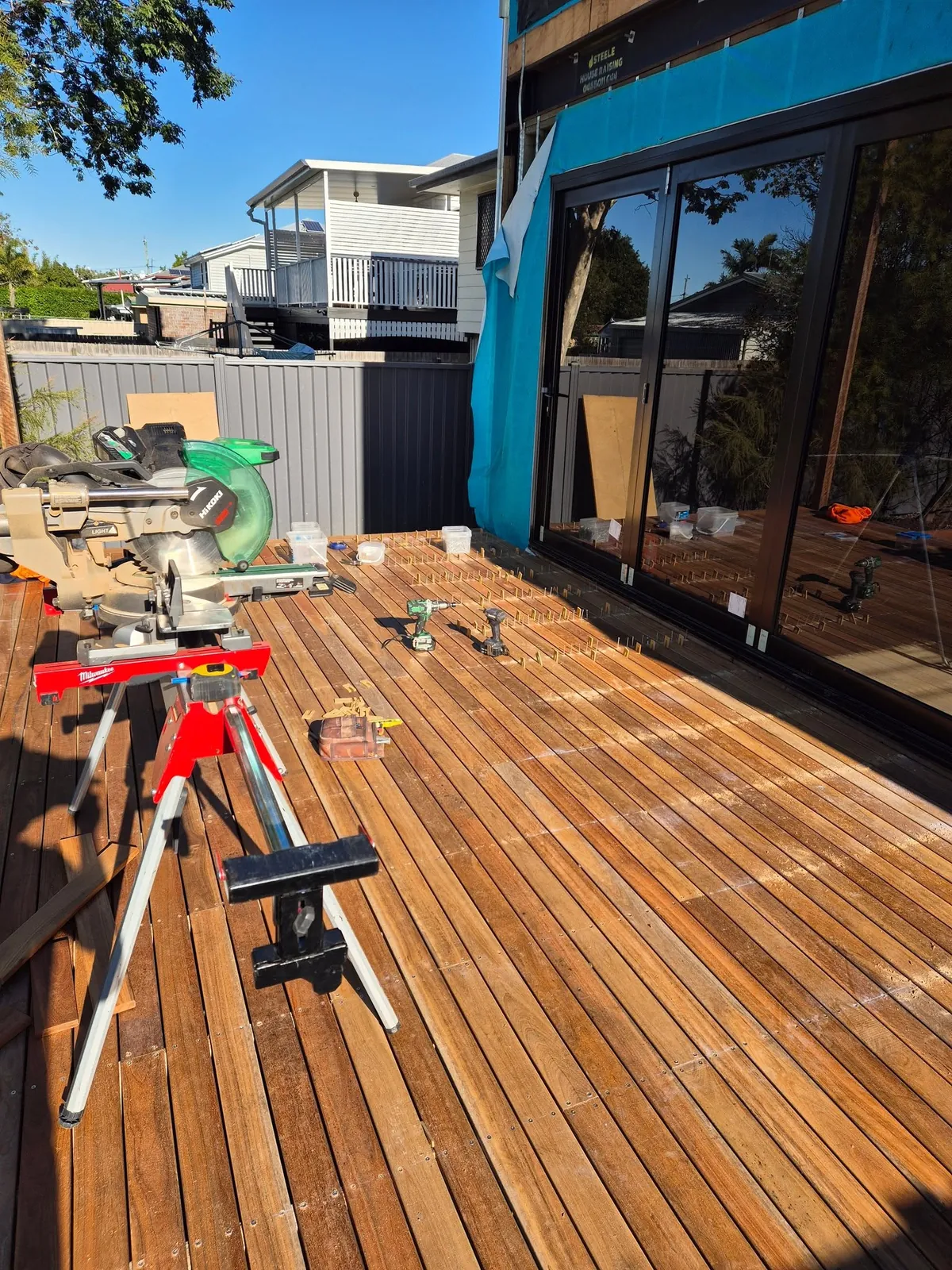 Cutting in on a timber deck — every board measured on site